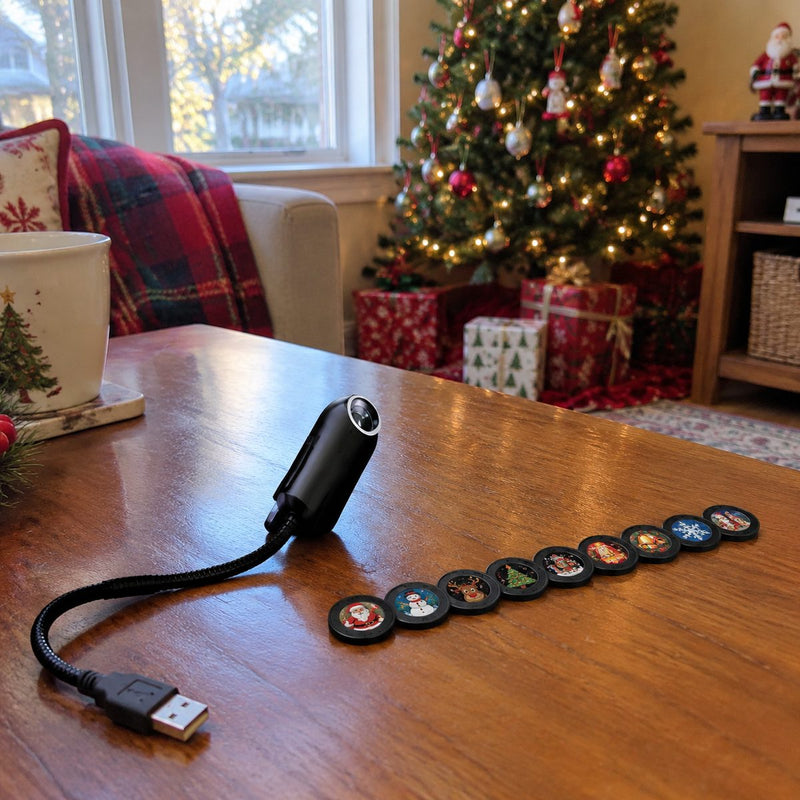 USB Christmas projector with its row of scene discs