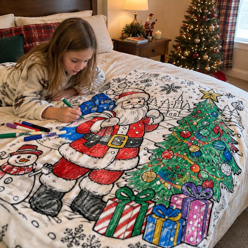 Girl coloring a large Christmas coloring blanket on a bed