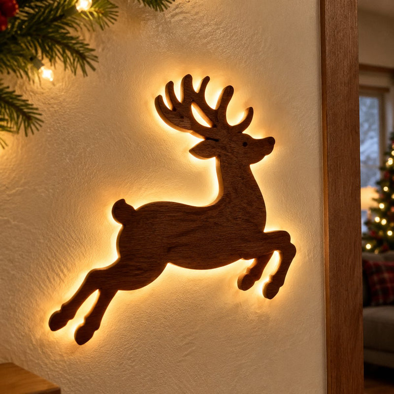 Close up of a glowing wooden reindeer wall light