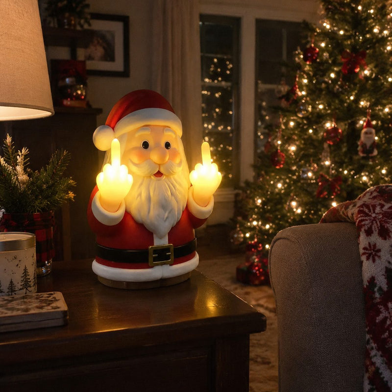 Naughty Santa novelty lamp glowing on a side table